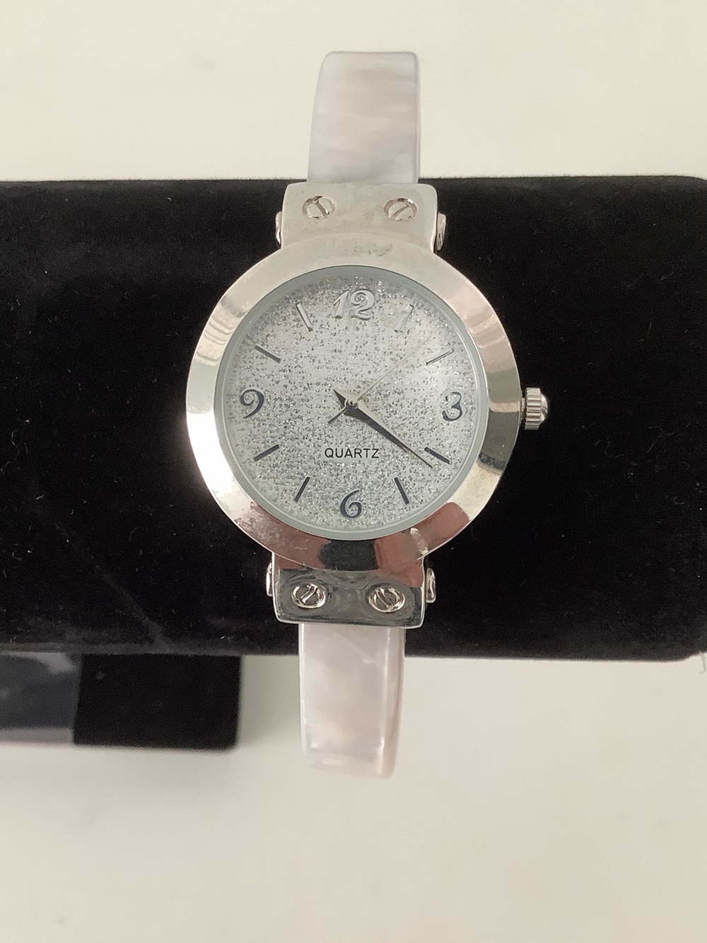 Mother of pearl bracelet watch.